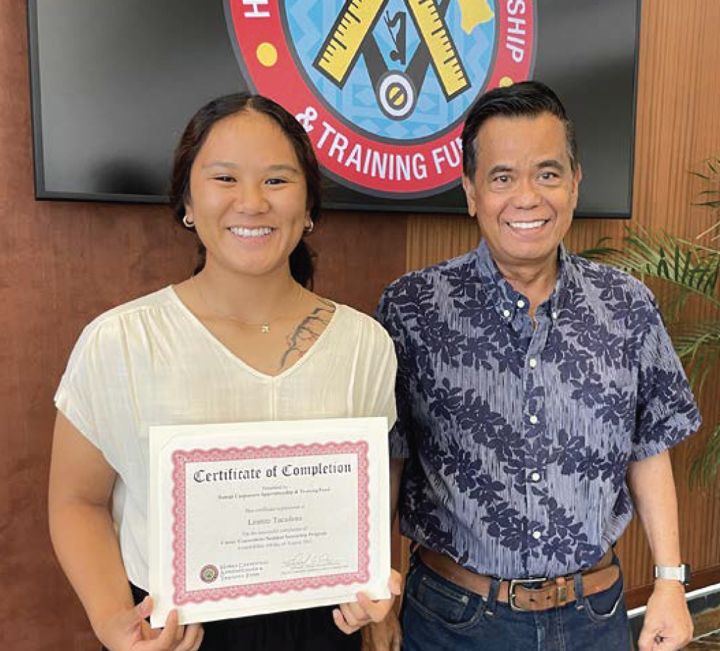 Training Director Edmund Aczon poses with female student to celebrate completion of summer internship.